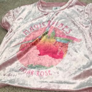 A pink velvet T-shirt with rainbows